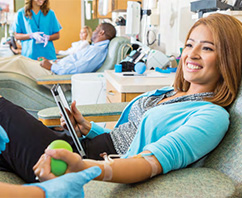 smiling patient with stress ball